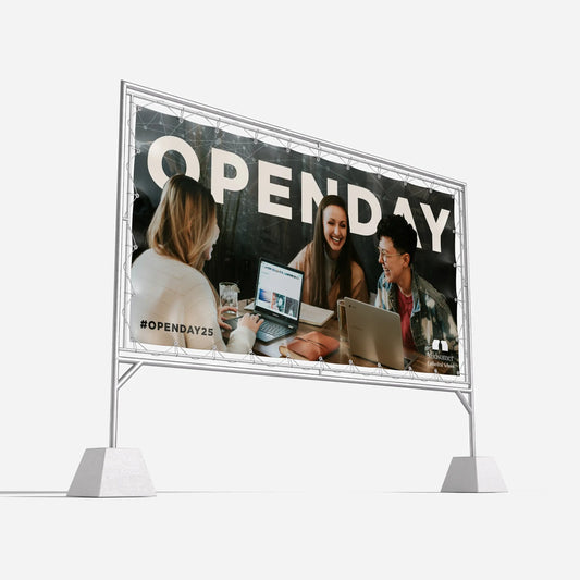 Outdoor banner with open day event design, featuring three people using laptops and smiling
