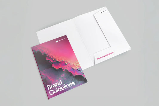 Interlocking presentation folder with a colorful brand guidelines booklet and white inserts