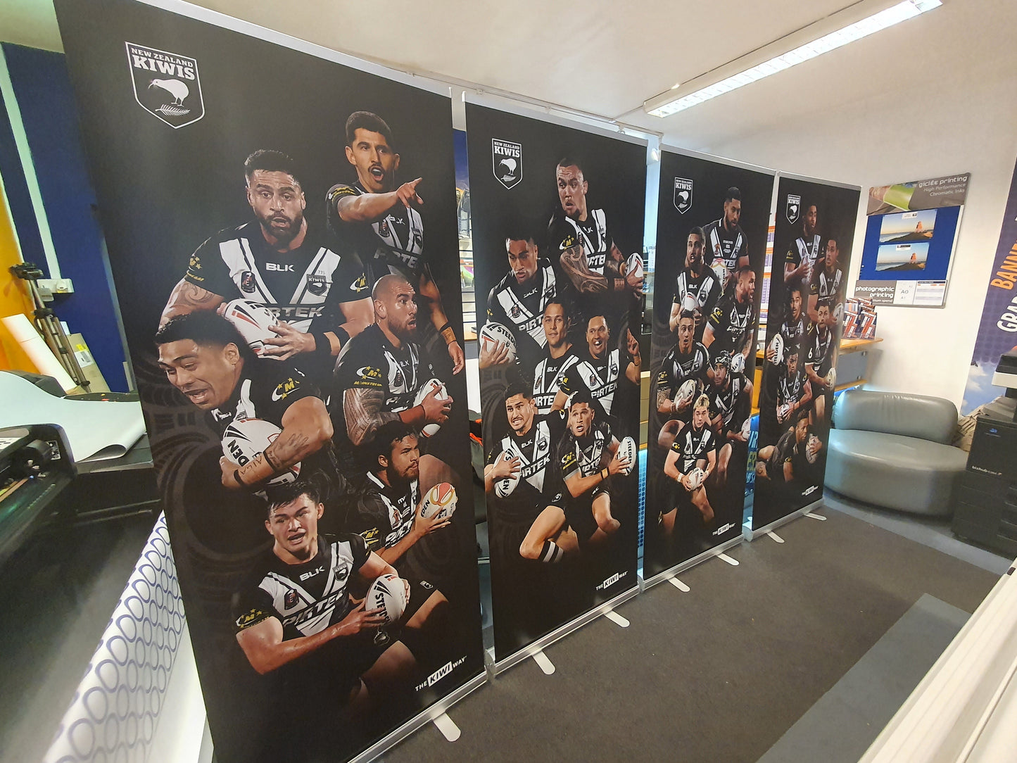 Row of promotional pop up banners featuring a Kiwi Rugby sports 